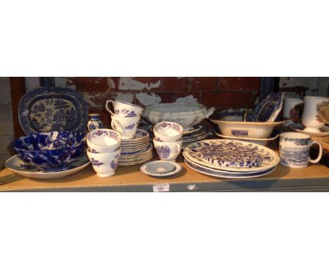 Shelf of assorted blue and white transfer pottery and china