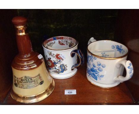 A Wade Bells Old Scotch Whisky decanter and a Wade two handled quart cider mug, limited edition replica of one in the Taunton