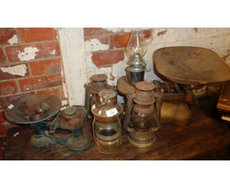 Four oil lamps and two sets of scales
