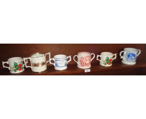 Six various Wade and other limited edition two handled pottery cider mugs