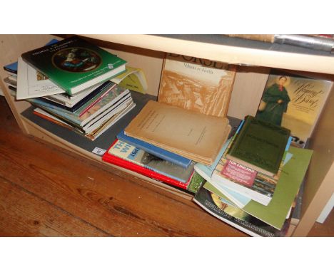 Shelf of assorted books, inc. local related with three 1935 copies of 'The Excavation of Maiden Castle', a Black's guide to D