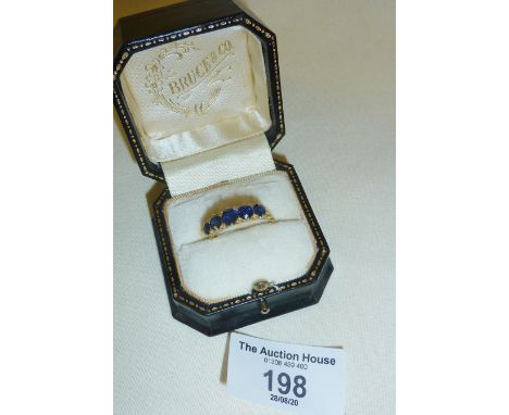 18ct gold ring set with five sapphires, approx UK size "R"
