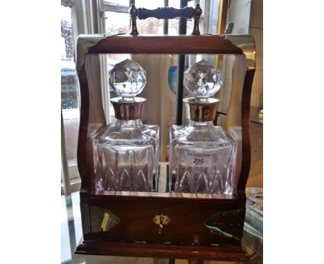 Silver mounted two bottle tantalus with silver mounted decanters