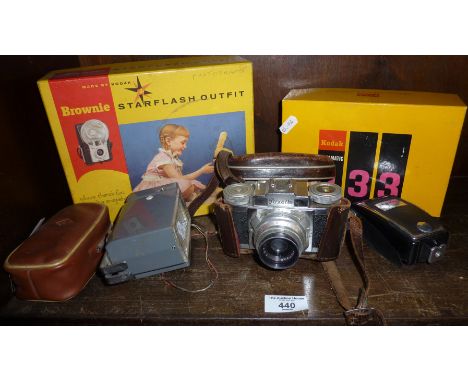 Braun Paxette camera, flash attachments, and a boxed Kodak Instamatic camera