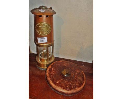 Old Miner's lamp and old surveyors tape