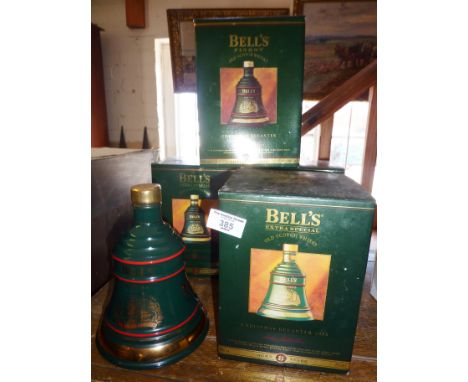Four Wade china Bell's Whisky Christmas decanters (unopened) with boxes