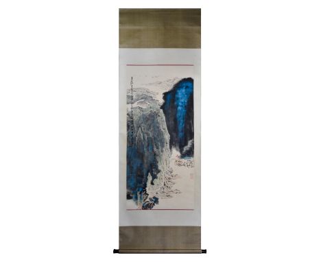 A beautiful Chinese scroll painting featuring a Chinese landscape with mountains and forests, all decorated with bright blue 