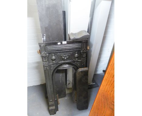 A BLACK SLATE FIRE SURROUND AND A CAST IRON PETITE EXAMPLE (2) 