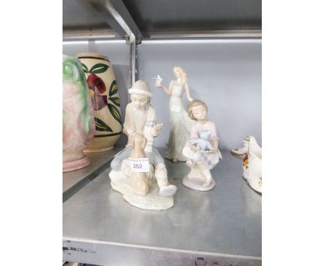 LLADRO FIGURINE OF  YOUNG GIRL PLAYING WITH HER TEDDY; NAO FIGURE GROUP OF A YOUNG MAN TEACHING HIS DOG TRICKS AND A CONTINEN