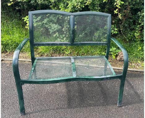 Green metal two seater garden bench measures approx 43 inches wide by 37 inches high and 19 deep 