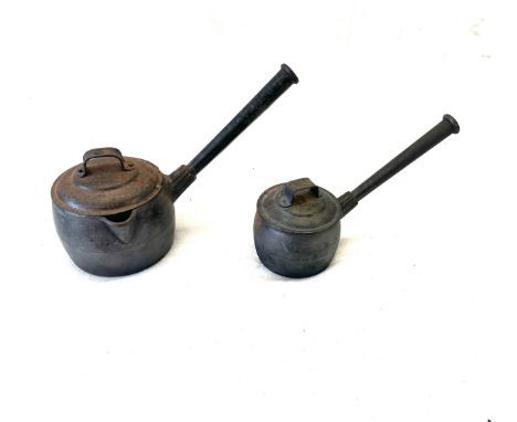 Two vintage cast iron sauce pots with lids one marked A K and sons 1.5 pint No2 and the other also marked 