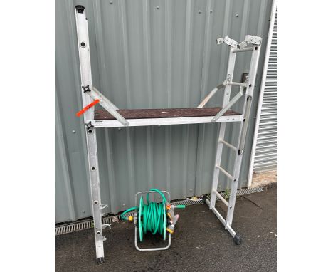 Aluminium decorators ladder and a hose 