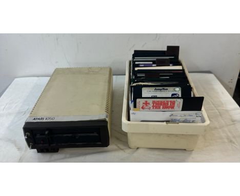 Vintage Atari 1050s console, untested and a large selection of Atari games includes Jump man, Tigers in the snow, Millionaire