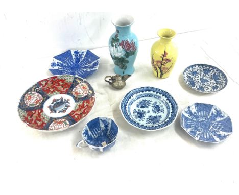 Selection of oriental pottery includes plates, vases, miniature dallah etc 