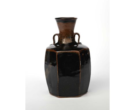 Φ Trevor Corser (born 1938)a Leach Pottery stoneware faceted vase, with flaring cylindrical neck and applied loop handles, co