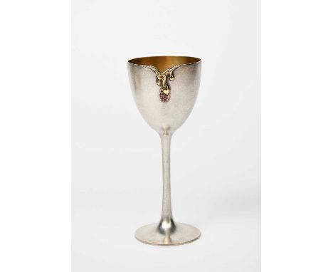 A textured silver gilt cup by Grant Macdonald for John Siddeley, the rim with faux melted edge drip, set with small ruby ston