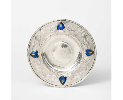 A silver and enamel plate by Agnes Frances Elanor Vyse, circular cast in low relief with winged panels, with applied enamel h