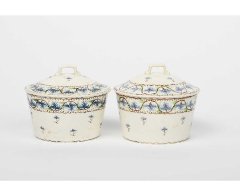 A pair of Wedgwood covered pots by Grace Barnsley, numbered 228, painted with bands of cornflowers, in blue, green and brown,
