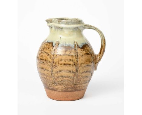 Mike Dodd (born 1943)a stoneware bellied jug, incised with vertical foliate stem motif, glazed ash with white ash to shoulder