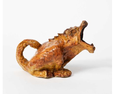 A grotesque earthenware Reptile jug in the manner of Robert Wallace Martin, dated 1901, modelled seated with head raised and 