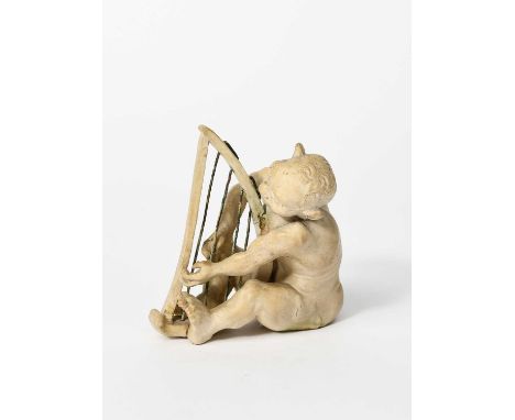 A Martin Brothers stoneware Imp Musician by Robert Wallace Martin, modelled seated playing the harp, glazed white, with eboni
