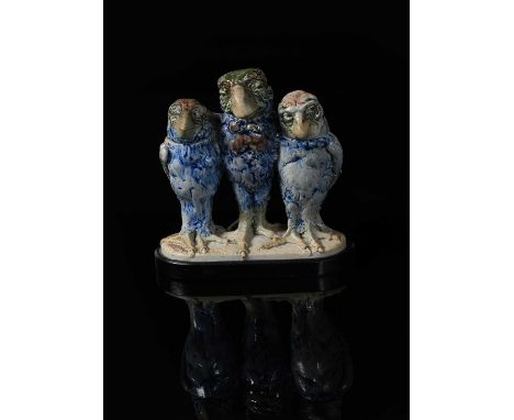 A rare Martin Brothers stoneware triple bird group by Robert Wallace Martin, dated 1905, the central bird modelled with wings