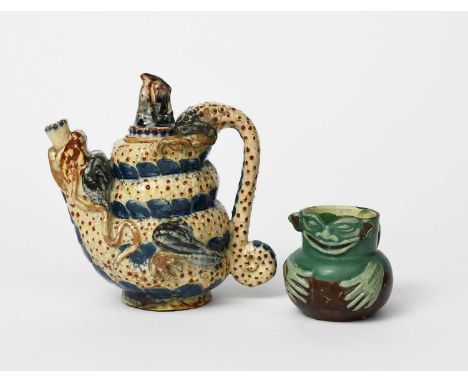 A C H Brannam Pottery Dragon coffee pot and cover, dated 1891, modelled in relief, glazed in blue and ochre on a cream ground