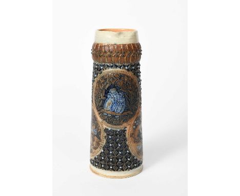 An early Martin Brothers stoneware jug by Robert Wallace Martin, dated 1874, tapering cylindrical form, incised with a rounde
