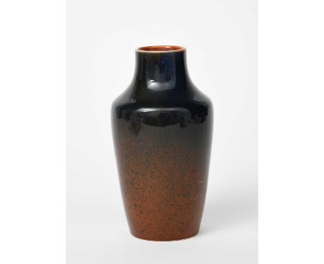 A Ruskin Pottery stoneware vase by William Howson-Taylor, shouldered form, covered in a streaked blue glaze over iron red, im