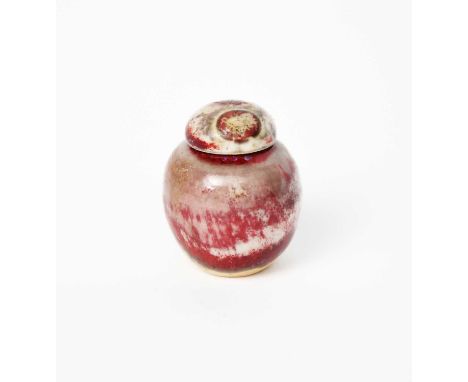 A rare Ruskin Pottery miniature high-fired stoneware ginger jar and cover by William Howson-Taylor, covered in a sang de boeu