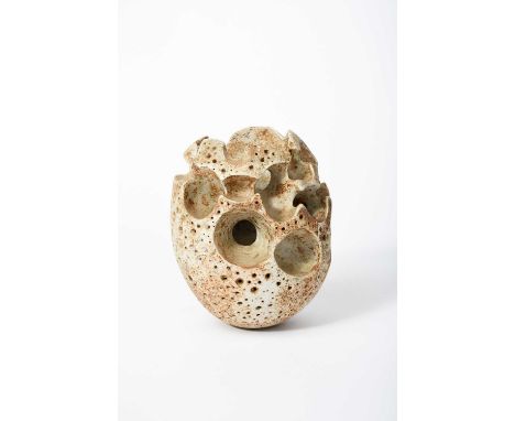 Φ Alan Wallwork (1931-2019)a stoneware vase, pierced form, glazed grey with buff patches,incised AW to base21.5cm. high Prove