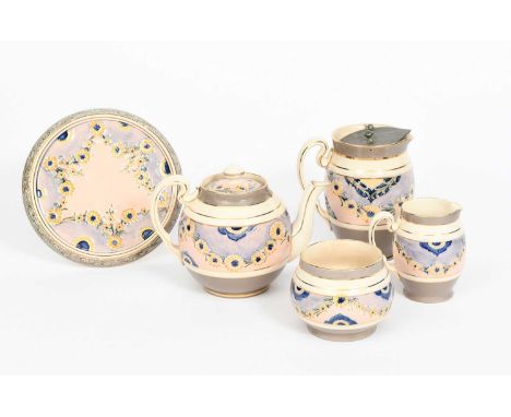 A James Macintyre & Co tea set designed by William Moorcroft, painted with a frieze of daisy chains in yellow, blue and green