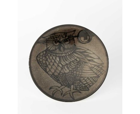 A Poole Pottery Aegean charger by Carolyn Wills, shape 54, resist decorated with an owl in the manner of Robert Jefferson, in