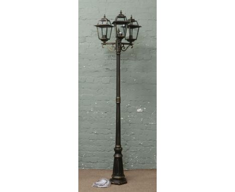 A new antique style three branch garden light in the form of a Victorian lamp post, complete with all fittings and ground anc