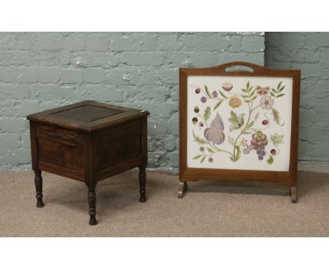 An early C20th commode with pot liner along with an oak framed firescreen embroidery panel.