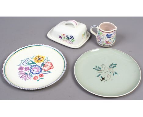 Four pieces of Poole pottery including a Chinese dish and cover.