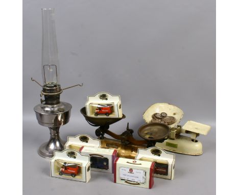 A pair of cast iron kitchen scales, chrome light, Aladdin lamp and six toy vehicles.