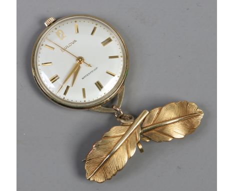 A gold plated Bolova nurses watch with white enamel dial waterproof case second and sweep finger suspended below a double fea
