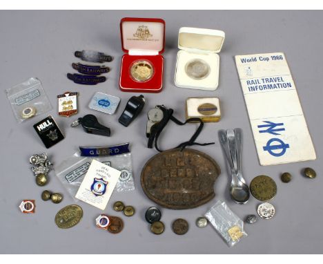 A collection of Railway related enamelled cap badges, lapel badges, guards whistles, uniform, badges and 1966 World Cup rail 