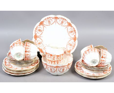 A Victorian Foley china part tea service printed with red borders. 9 cups and saucers. 8 side plates, jug, sugar bowl and bre