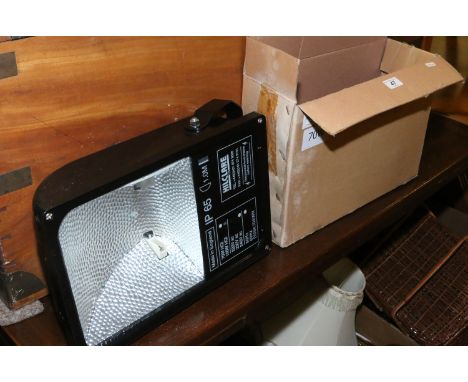 A new and boxed 230 volt 70 watt HQI flood light