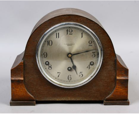 A vintage oak cased eight day mantel clock by H. L. Brown & Sons Sheffield, Westminster chiming.