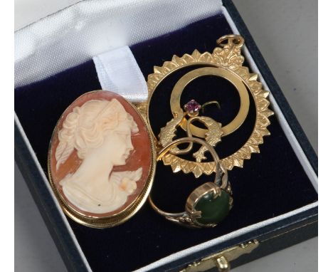 An 18 carat gold mounted cameo brooch a 9 carat gold openwork pendant and a 9 carat gold jade mounted ring