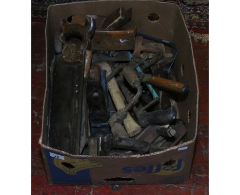 A box of vintage wood working tools, planes, hand saws, etc