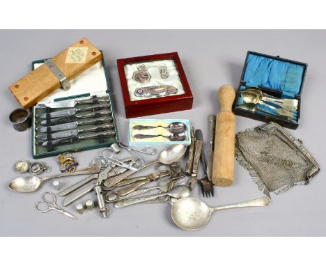 A box of collectables including silver handled tea knives, enamel rail inspectors badge, chain purse and a pocket knife and w