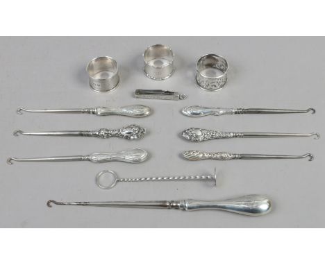 A collection of silver items to include boot pulls, napkin rings, multi tool etc, gross weight 350 grams