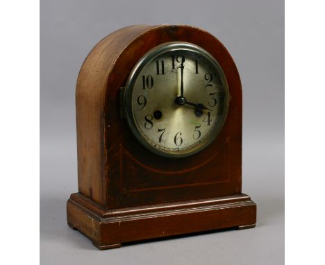 An early C20th walnut cased 30 hour dome top mantel clock with silvered dial and chiming on coiled gong.
