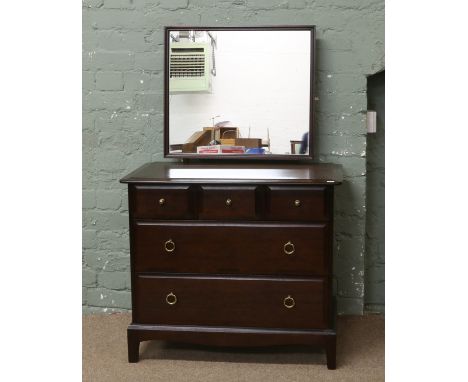 A Stag dressing table with three over two drawer base raised on bracket feet.