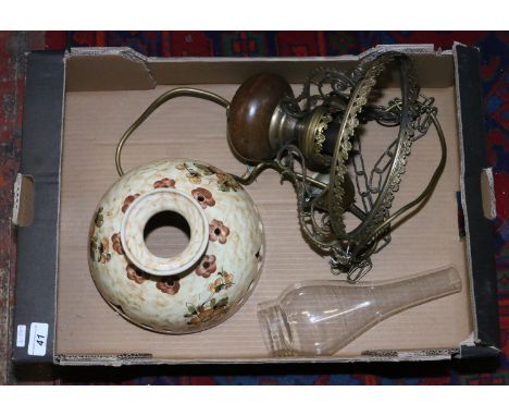 A brass hanging light with pottery shade in the style of an old parafin lamp.