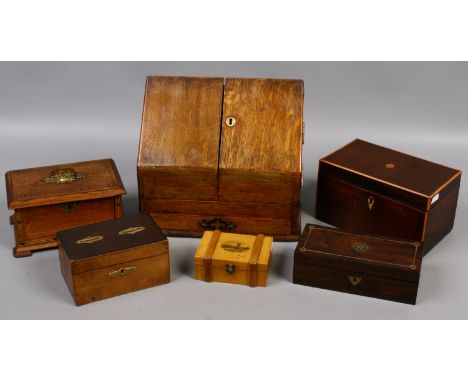 A vintage oak stationary box with fitted interior along with a Victorian tea caddy, a mauchlin box and two other wooden boxes